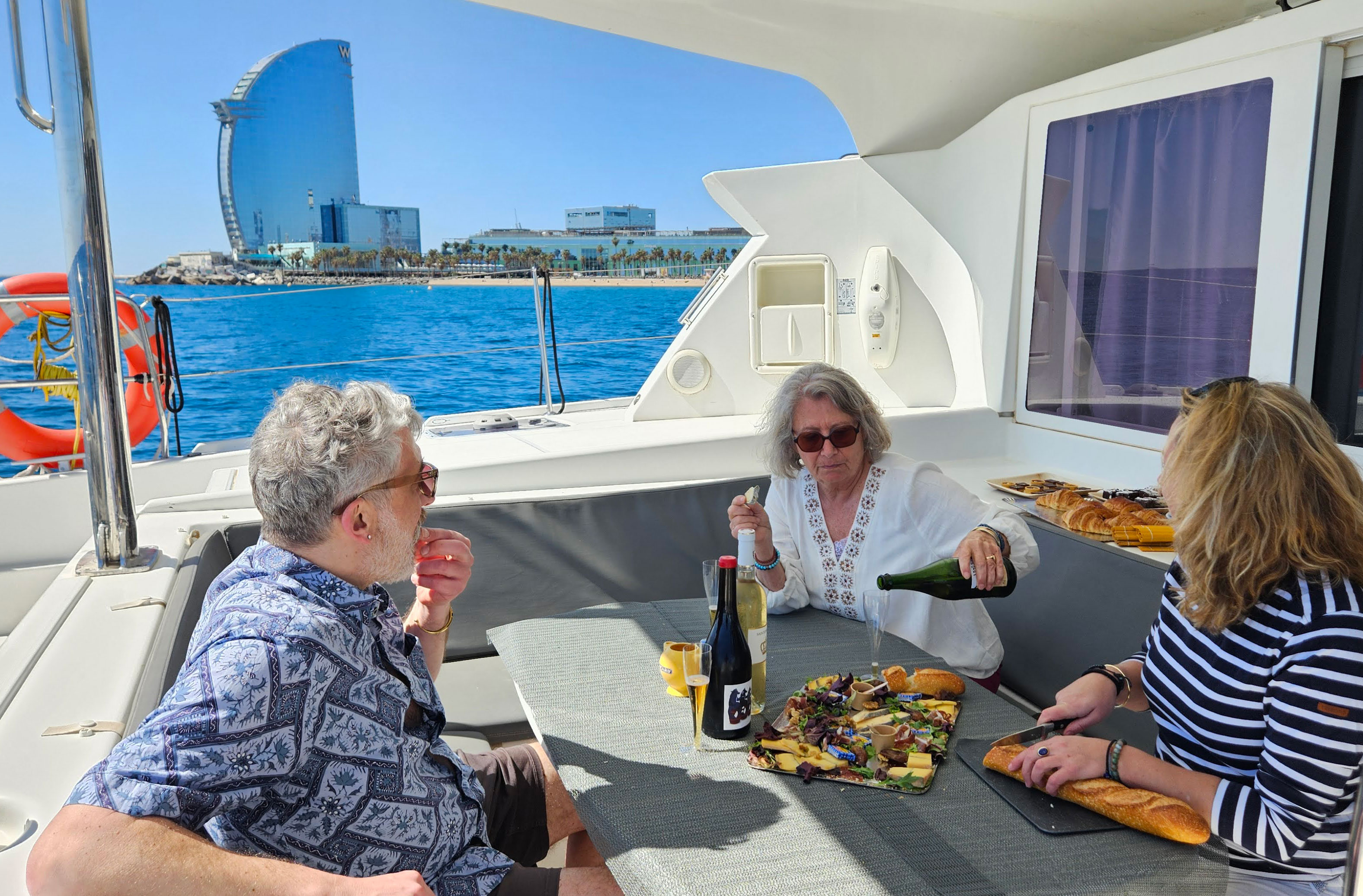 Sommelier guiding an organic wine tasting aboard a catamaran in Barcelona